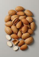 Close up of almonds in and out of shells create a visually appealing and healthy food composition. photo