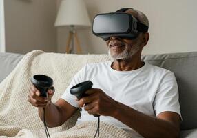An elderly gentleman enjoys a virtual reality experience with headset and controllers at home. photo