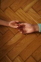Gentle touch of mother and son hands. Kundalini practices with activating inner energy photo