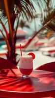Refreshing Tropical Drink on a Red Table in Sunlit Paradise photo