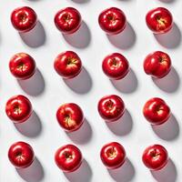 Fresh red apples arranged in a neat pattern photo