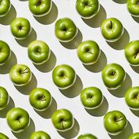 Fresh green apples arranged on a white background photo