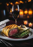 Decadent gourmet meal with red wine photo