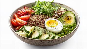 Nutritious salad bowl with quinoa, avocado, boiled egg, and fresh vegetables photo