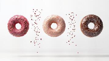 Colorful Donuts with Sprinkles Floating Against a White Background photo