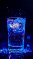 Vibrant Sparkling Water in a Glass Against a Blue Glitter Background photo