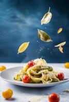 Vibrant Pasta Dish with Fresh Leaves and Cherry Tomatoes on a Blue Background photo