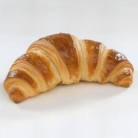 Deliciously Golden Croissant on a Clean Surface photo