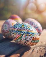 Colorful Hand-Painted Easter Eggs on Rustic Wood Surface with Soft Background photo