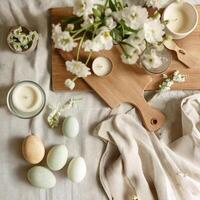 A Beautiful Spring Table Setting with Candles and Decorative Eggs photo