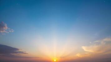 Breathtaking Sunrise Over Calm Ocean with Soft Clouds photo