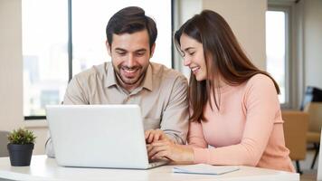 Young couple enjoying a productive session together on a laptop photo