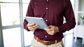 Professional using a tablet in a modern workspace photo