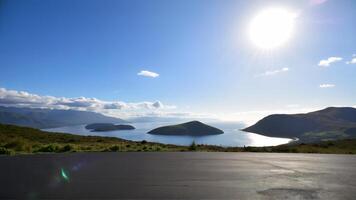 Stunning panoramic view of serene islands and mountains under a bright sky photo