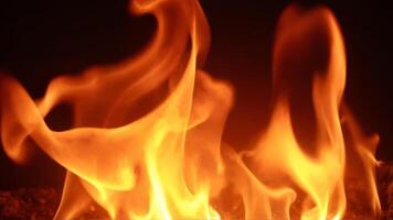 Dynamic Flames Dancing in a Dark Background for Visual Impact photo