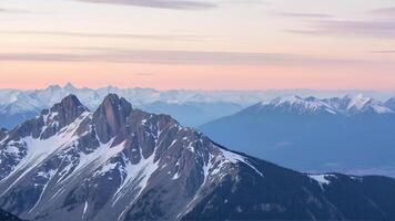 Serene Mountain Landscape with Snow-Capped Peaks at Dawn photo