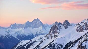Majestic Snow-Capped Mountains Under a Soft Sunrise photo
