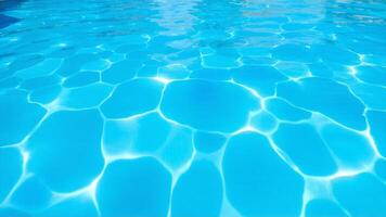 Crystal Clear Water Patterns in a Swimming Pool Under Sunlight photo