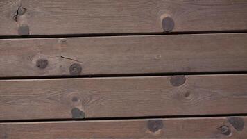 Textured Brown Wooden Planks with Distinctive Knots and Grain Patterns photo