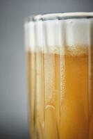 A close up of a glass of beer photo