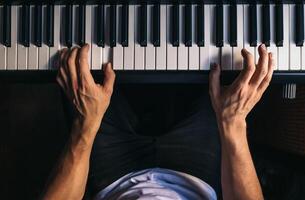 man playing piano. top view. photo