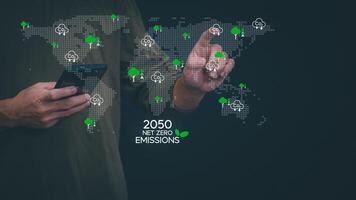 man using smart phone with green energy icons photo