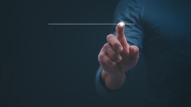 a person is pointing at a button with a line on it photo