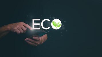 eco concept man holding smartphone with eco text on screen photo