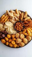 A Wooden Platter Displaying Various Fried Savory Snack Foods photo