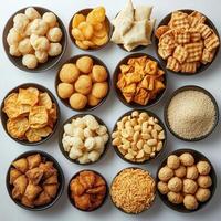 A collection of various snack bowls arranged on a white background photo