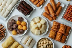 Assorted types of snack foods arranged on white plates evenly photo