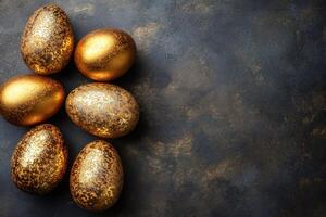 Golden easter eggs arranged on dark background creating festive atmosphere photo