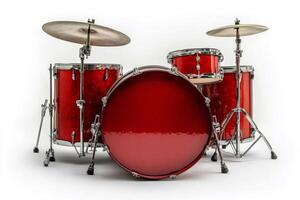 Shiny red drum set isolated on white background ready for playing photo