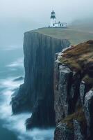 Neist point lighthouse standing on misty cliffs in scotland photo
