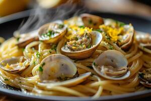 Steaming hot spaghetti with clams and lemon zest, creating an aromatic culinary experience photo