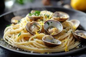 Steaming spaghetti with clams, lemon zest, and parsley photo