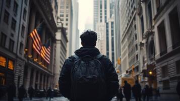 Man with Backpack Walking Down a City Street photo
