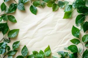 Green leaves bordering wrinkled paper background creating empty space photo