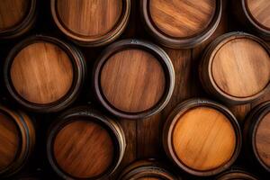 Wine cellar with stacked oak barrels showing aging process photo