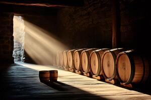 Wine cellar with oak barrels illuminated by sunlight beams creating a dramatic atmosphere photo