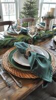 Festive holiday table setting with elegant green napkins and pine decor photo