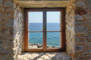 Serene ocean view through rustic stone window frame photo