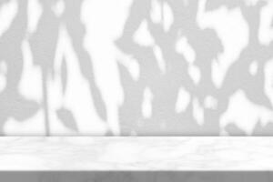 Marble Table with Tree Shadow on Concrete Wall Texture Background photo