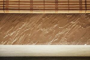 Minimal Table with Japanese Wooden Blinds and Rough Stucco Background photo