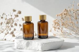 Two bottles of essential oil sitting on a white surface photo