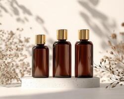 Three bottles of essential oils are on a white surface photo