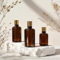 Three bottles of essential oils sit on a white surface photo