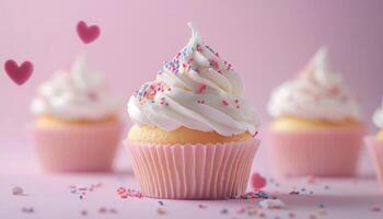 Cupcakes with pink frosting and hearts photo