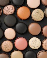 Macarons on black background photo