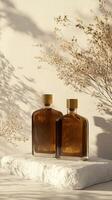 Two bottles of perfume sitting on a white surface photo